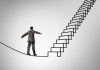 Will you choose fear or opportunity? Man on highwire approaching stairs